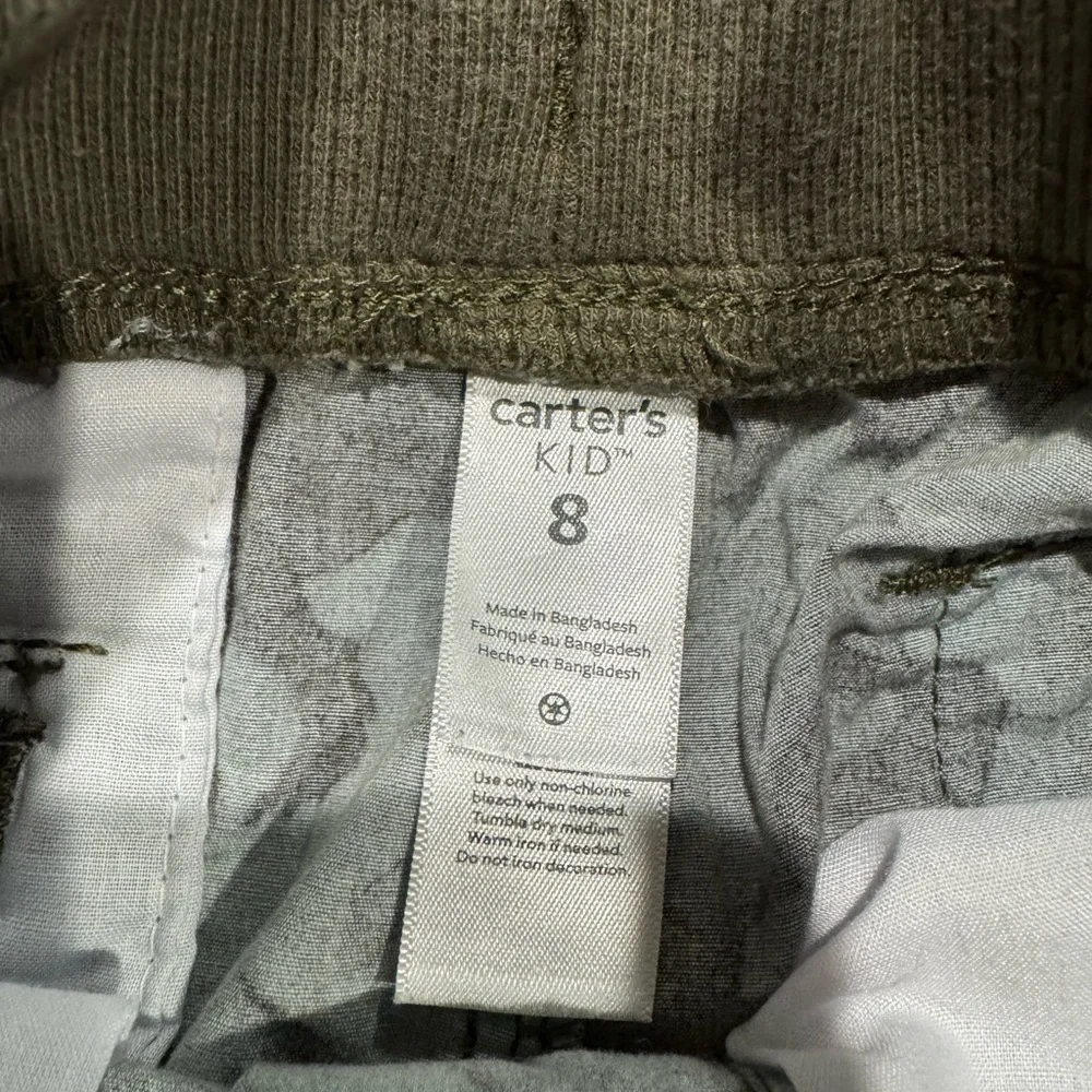 New without tags. Carters Dino print shorts size 8